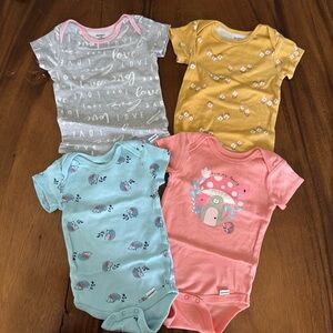 Gerber Set of Four Baby Onesies in Gray, Yellow, Blue, and PinkSize 6-9M